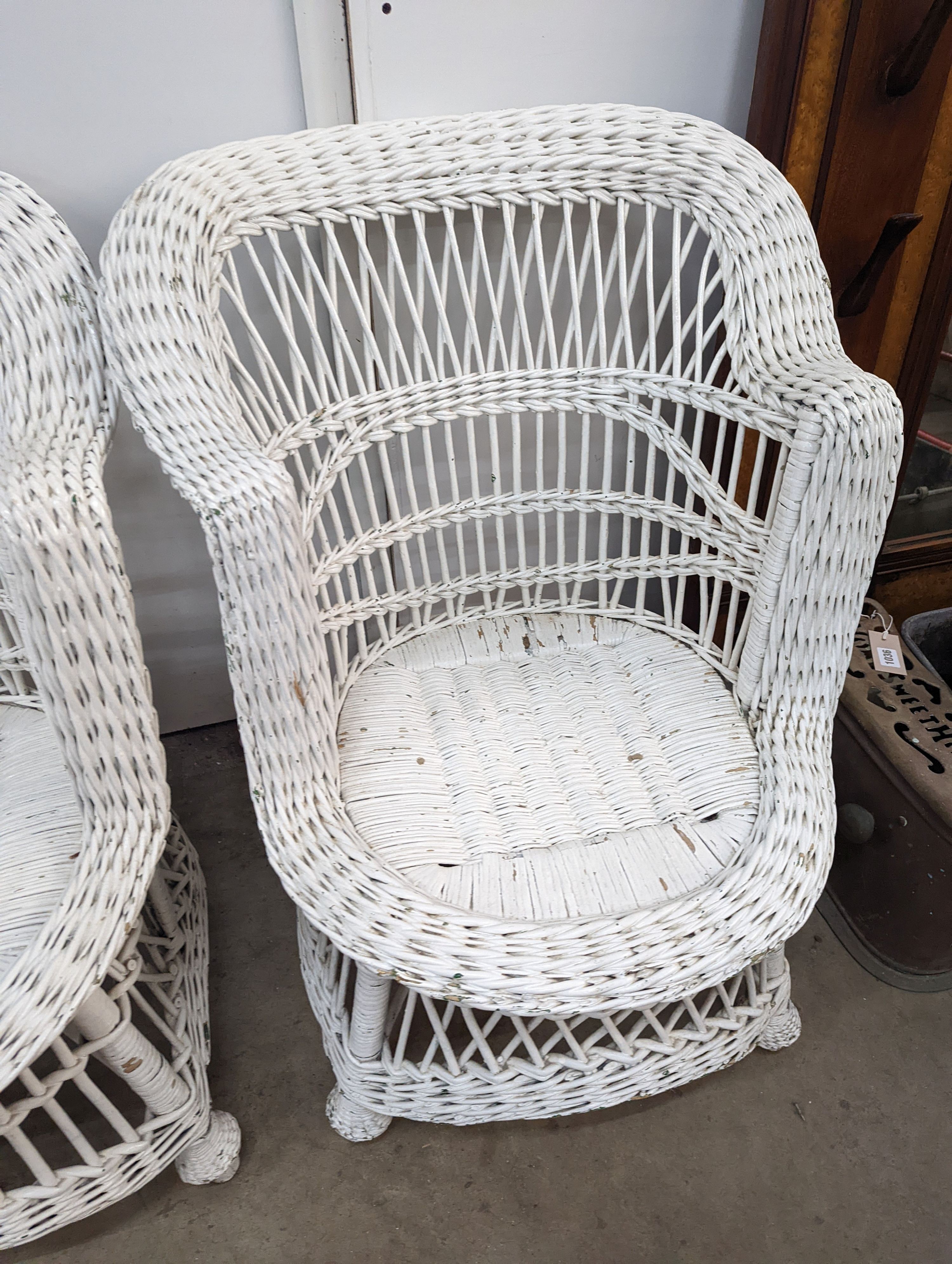 A pair of painted rattan conservatory chairs, width 65cm, height 79cm